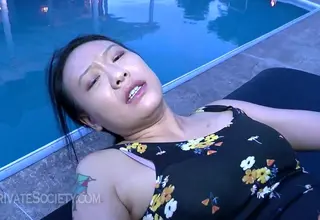 A sweet Asian amateur enjoys anal pleasure in an outdoor setting. The encounter features an 18-year-old with a cute appearance.